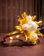 Load image into Gallery viewer, Elegant gold ring with pearl accents in floral design